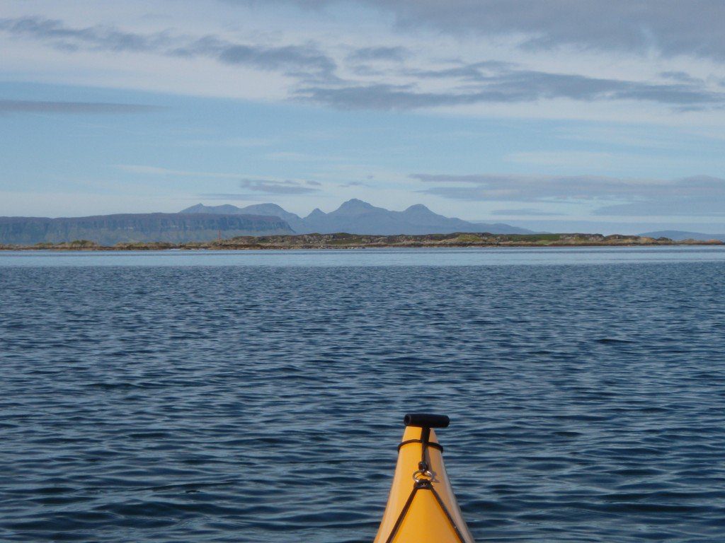 Island of Luinga Mhor with Eigg and Rhum in the distance